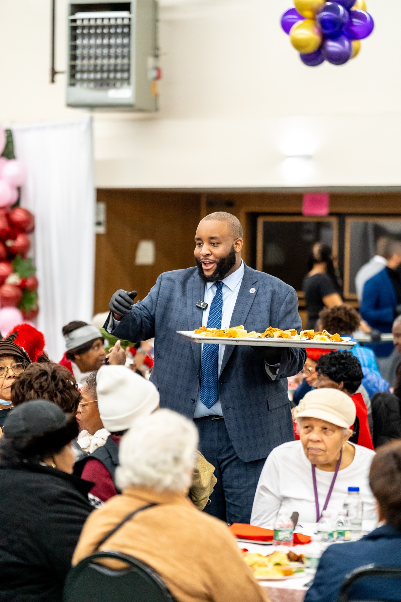 Chris Worrell serving seniors at community holiday event